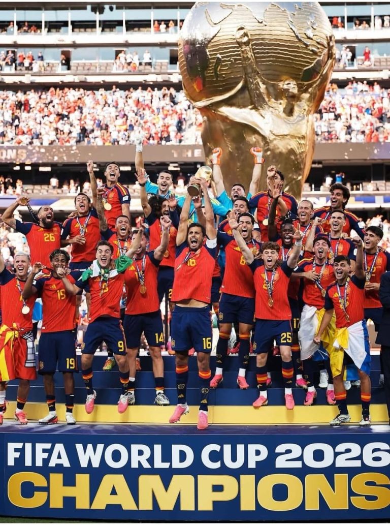 The Spain national football team celebrating on the podium as official FIFA World Cup 2026 Champions with Rodri lifting the trophy.